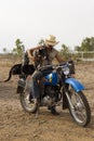 Modern female drover cowgirl with her equipment Royalty Free Stock Photo