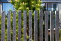 Modern fence made of bars pillars of gray, mountain, Silesian slate