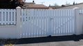 Modern fence white gate aluminum portal with blades design of suburban house