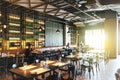 Modern Fine Dining Restaurant decorated with steel and open ceiling with customers inside in Bangkok, Thailand