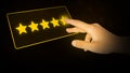 Modern Five Star Rating Background with Yellow Glowing Stars and Hand Touching the Screen. Review backdrop