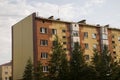 Modern five-storeyed house with flats. It was colored in red, orange and white colors Royalty Free Stock Photo