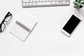 Modern flat lay with office items on white desk background top view mockup