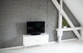 Modern flat lcd television set on white cabinet. Royalty Free Stock Photo