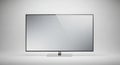 Modern flat screen television display technology device with sleek design stand Royalty Free Stock Photo