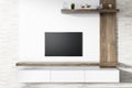 Flat screen TV on white living room wall