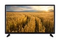 Modern flat TV with a road in ripe wheat ears on the screen Royalty Free Stock Photo