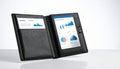 Modern Foldable Tablet Displaying Financial Data Royalty Free Stock Photo
