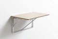 Modern Foldable WallMounted Table in White Against a Plain Wall Royalty Free Stock Photo