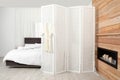 Modern folding screen in stylish bedroom