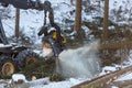 modern forestry machine in a winter forest Royalty Free Stock Photo