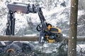 modern forestry machine in a winter forest Royalty Free Stock Photo