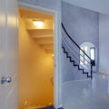 Modern foyer. View of staircase to basement