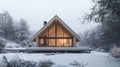 Modern A-Frame Cabin in Snowy Winter Landscape Royalty Free Stock Photo