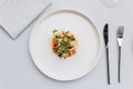 Modern French cuisine: Top view of lobster tail salad including lobster, asparagus and roasted sunflower seeds with white sauce.