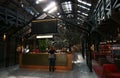 Modern front desk reception in historic industrial building with wood roof trusses and ceiling skylight windows. Adaptive reuse.