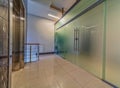 Modern frosted glass doors entrance near elevator