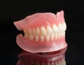 Full denture dentures on black Royalty Free Stock Photo