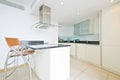 Modern fully fitted kitchen in vanilla white