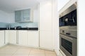 Modern fully fitted kitchen in vanilla white