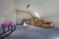 Modern furnished attic room with toys