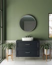 A modern furnished bathroom with a circle round mirror on a green wall and a modern vanity sink Royalty Free Stock Photo