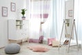 Modern furniture and window curtains in stylish room Royalty Free Stock Photo