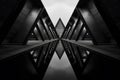 Modern, futuristic building made of concrete, steel, glass. Symmetrical geometric forms in monochromatic color scheme Royalty Free Stock Photo