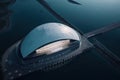 Modern futuristic concert hall, ocean academia, fluid organic forms, AI generative aerial shot