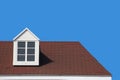 modern gable roof design house wall with clear blue sky background. Royalty Free Stock Photo