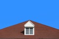 modern gable roof design house wall with clear blue sky background. Royalty Free Stock Photo