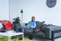 Modern gadgets on table in front of african american man