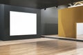 Modern gallery interior with concrete walls, empty white mock up banner and wooden flooring. Royalty Free Stock Photo