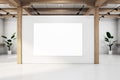 A gallery interior with a large blank white canvas on a clean wall, natural wood accents, and spotlights, representing an Royalty Free Stock Photo