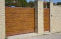 Modern garage door or house fence entrance gate on the street side Royalty Free Stock Photo