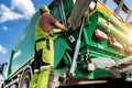 Modern Garbage Truck and Caucasian Waste Collector Royalty Free Stock Photo