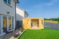 Modern Garden Completed with Newlly Erected Cabin Styled Summerhouse Royalty Free Stock Photo