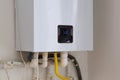 Modern gas boiler. Heating and hot water system in the house. Background Royalty Free Stock Photo