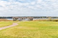 Modern gazebo near the lake with cloudy sky