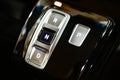 Modern gearbox control button on a central console in a new car Royalty Free Stock Photo