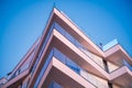 Modern geometric Building against blue Sky in Low Angle and perspective side view, Abstract Architecture background Royalty Free Stock Photo