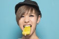 Modern girl eating ice cream with funny expression Royalty Free Stock Photo