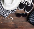 Modern girl outfit on the wooden background, top view. Royalty Free Stock Photo