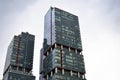 Modern glass building in the city center, business center with blue sky Royalty Free Stock Photo