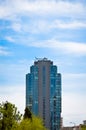 Modern glass building in the city center, business center with blue sky Royalty Free Stock Photo