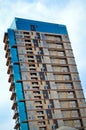 Modern glass building in the city center, business center with blue sky Royalty Free Stock Photo