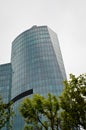 Modern glass building in the city center, business center with blue sky Royalty Free Stock Photo