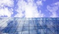 Modern glass building. Cloudy sky background, under view, space. Royalty Free Stock Photo