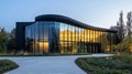 Modern Glass Building with Curving Facade at Dusk Royalty Free Stock Photo