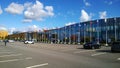 Modern glass building exterior of Congress and exhibition expo centre Expoforum. Flags of different countries on flagpoles against